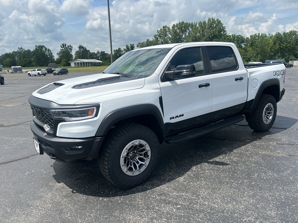 2026 RAM Ram 1500 RAM 1500 RHO CREW CAB 4X4 5'7' BOX in Bright White Clear-Coat Exterior Paint — front three-quarter view