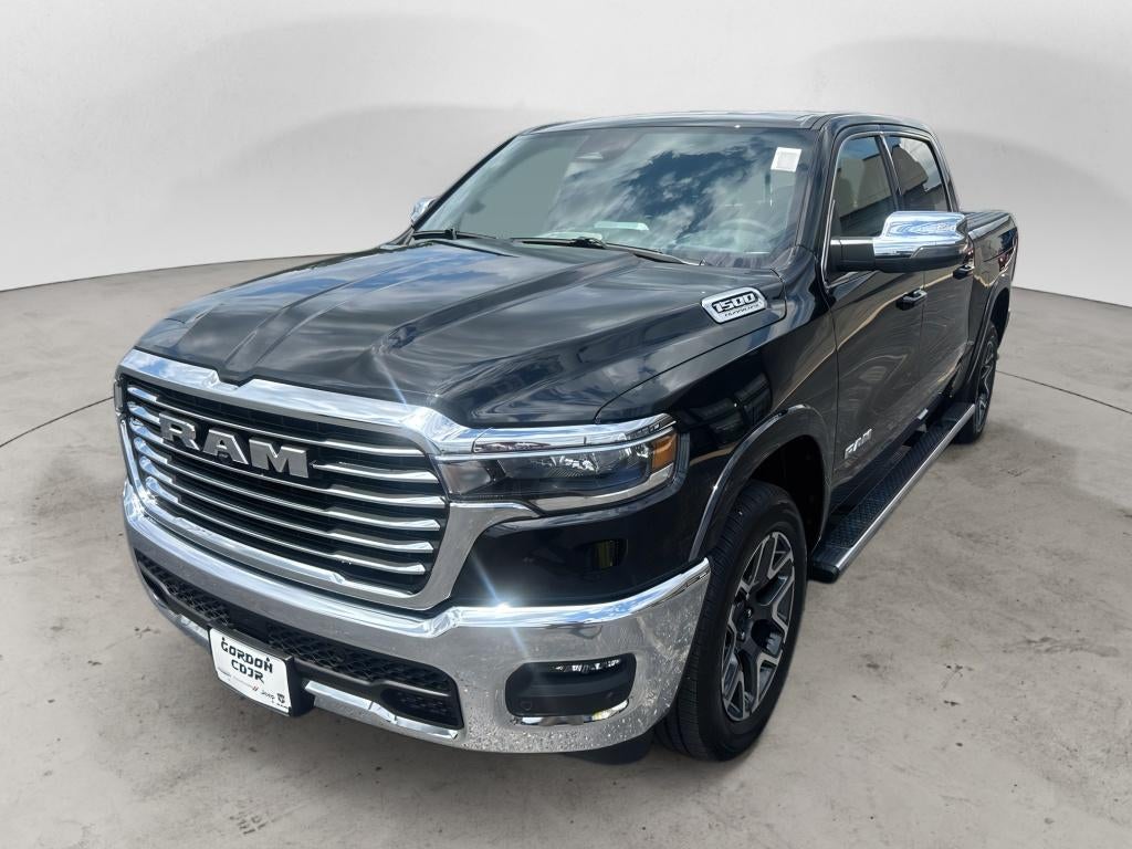2026 RAM Ram 1500 RAM 1500 LARAMIE CREW CAB 4X4 5'7' BOX in Diamond Black Crystal Pearl-Coat Exterior Paint — front three-quarter view